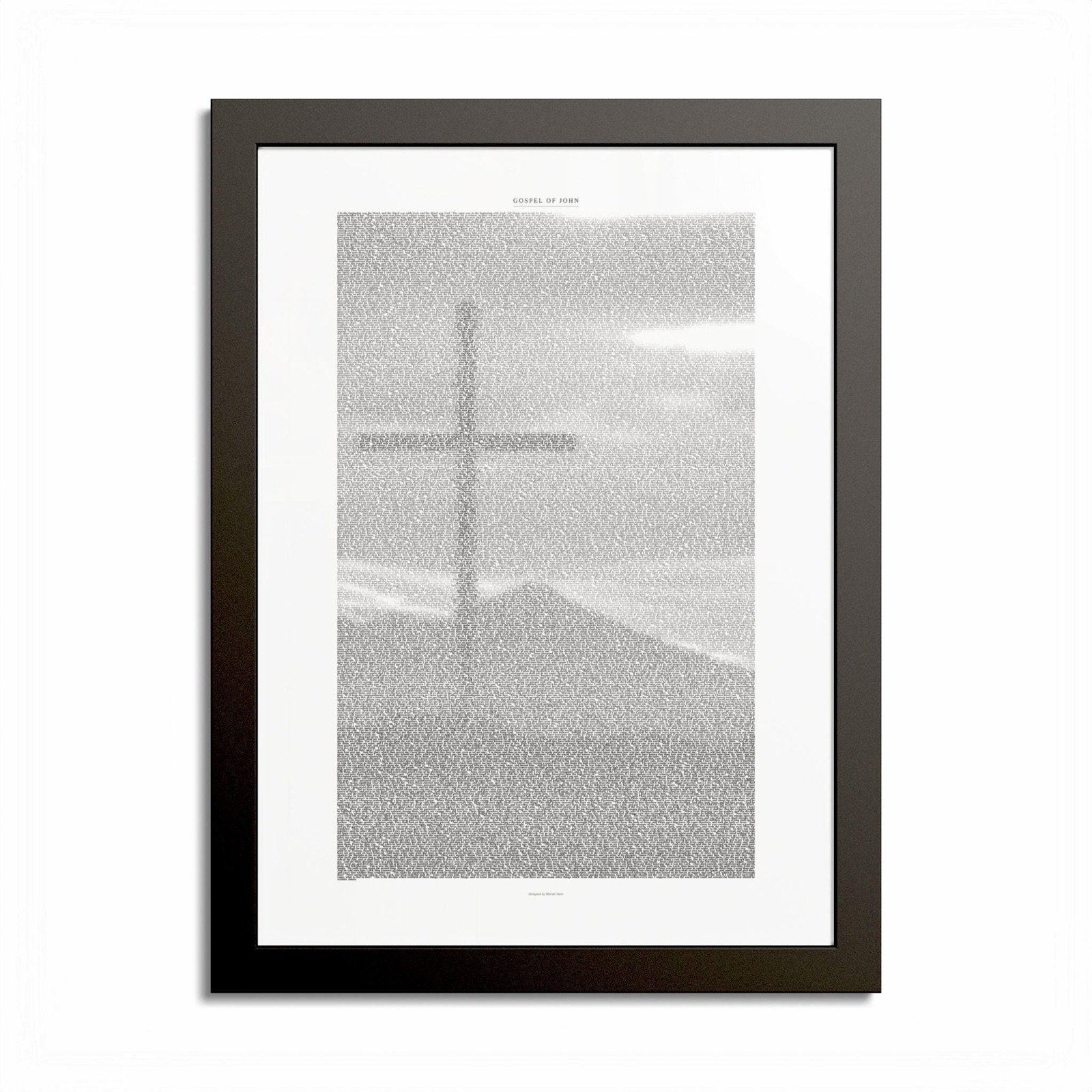 Framed print of the Gospel of John, the entire text shaped into a cross on a mountain